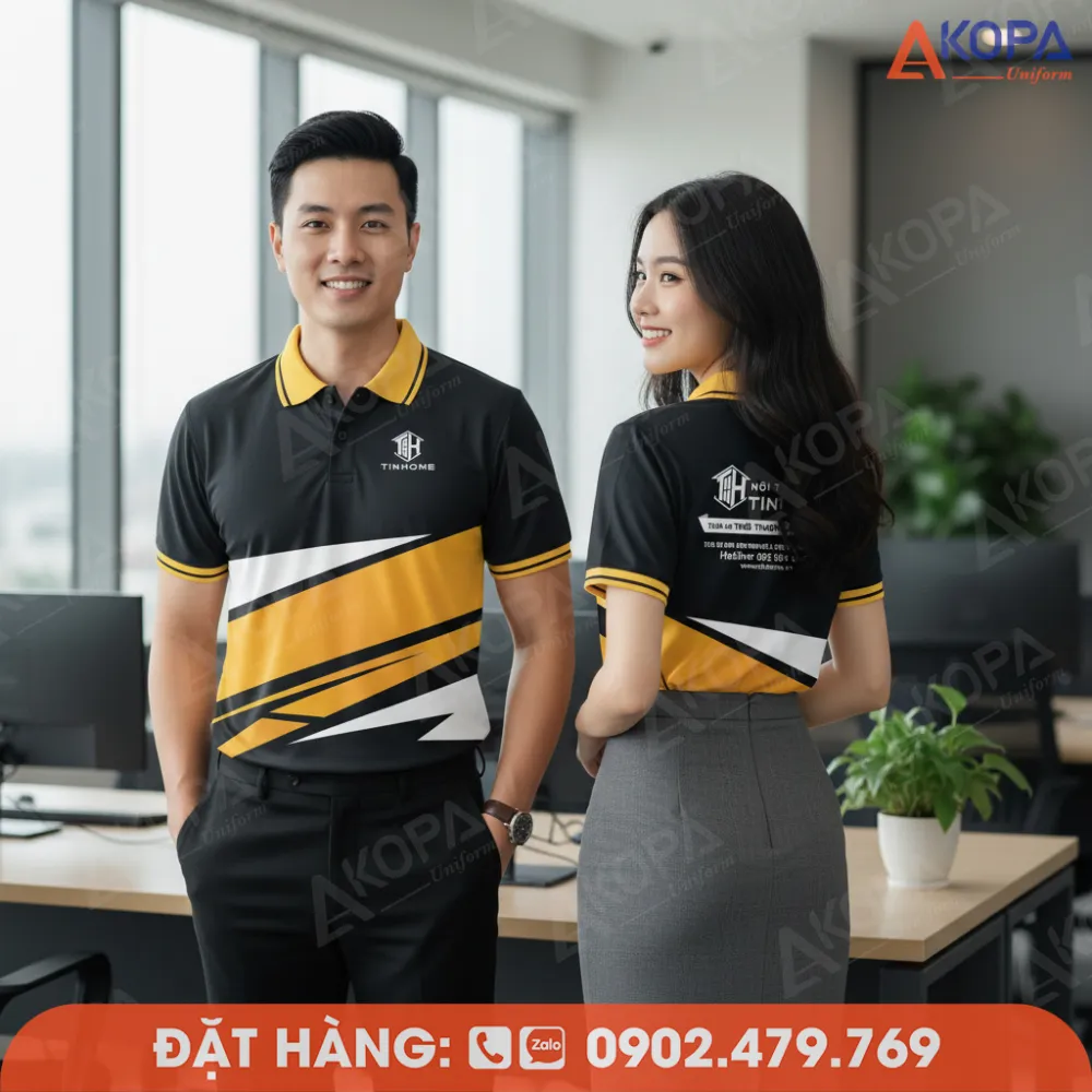 nam nữ mặc áo polo phối vàng đen trong không gian làm việc
