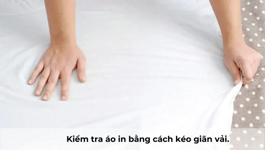 kiểm tra độ co giãn vải áo thun đồng phục trước khi sản xuất