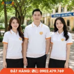 Thiết kế áo đồng phục họp lớp trắng cam hiện đại, phù hợp chương trình kỷ niệm 15 năm ra trường.