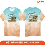 Áo phông đồng phục nhóm thiết kế màu loang xanh cam độc đáo cùng slogan “Đoàn kết chấp hết khó khăn”, phù hợp cho du lịch, teambuilding và sự kiện tập thể.
