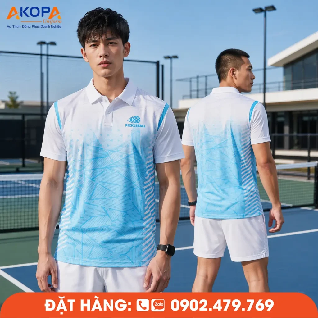 Áo đồng phục Pickleball trắng phối xanh dương hiện đại, chất liệu co giãn 4 chiều, thoáng khí, thấm hút mồ hôi nhanh, phù hợp thi đấu, tập luyện và may đồng phục Pickleball theo yêu cầu.