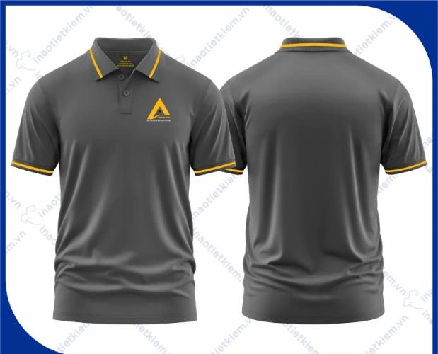 Mẫu áo polo đồng phục màu xám đậm viền vàng in logo công ty nội thất, xây dựng, mặt trước và mặt sau – AKOPA